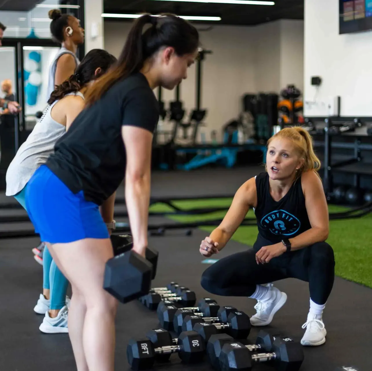 Body Fit Training coach and members during a workout
